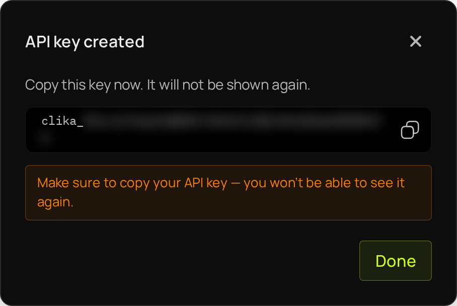 The API key created dialog: the new key, which starts with clika_, the copy button next to it, and Done